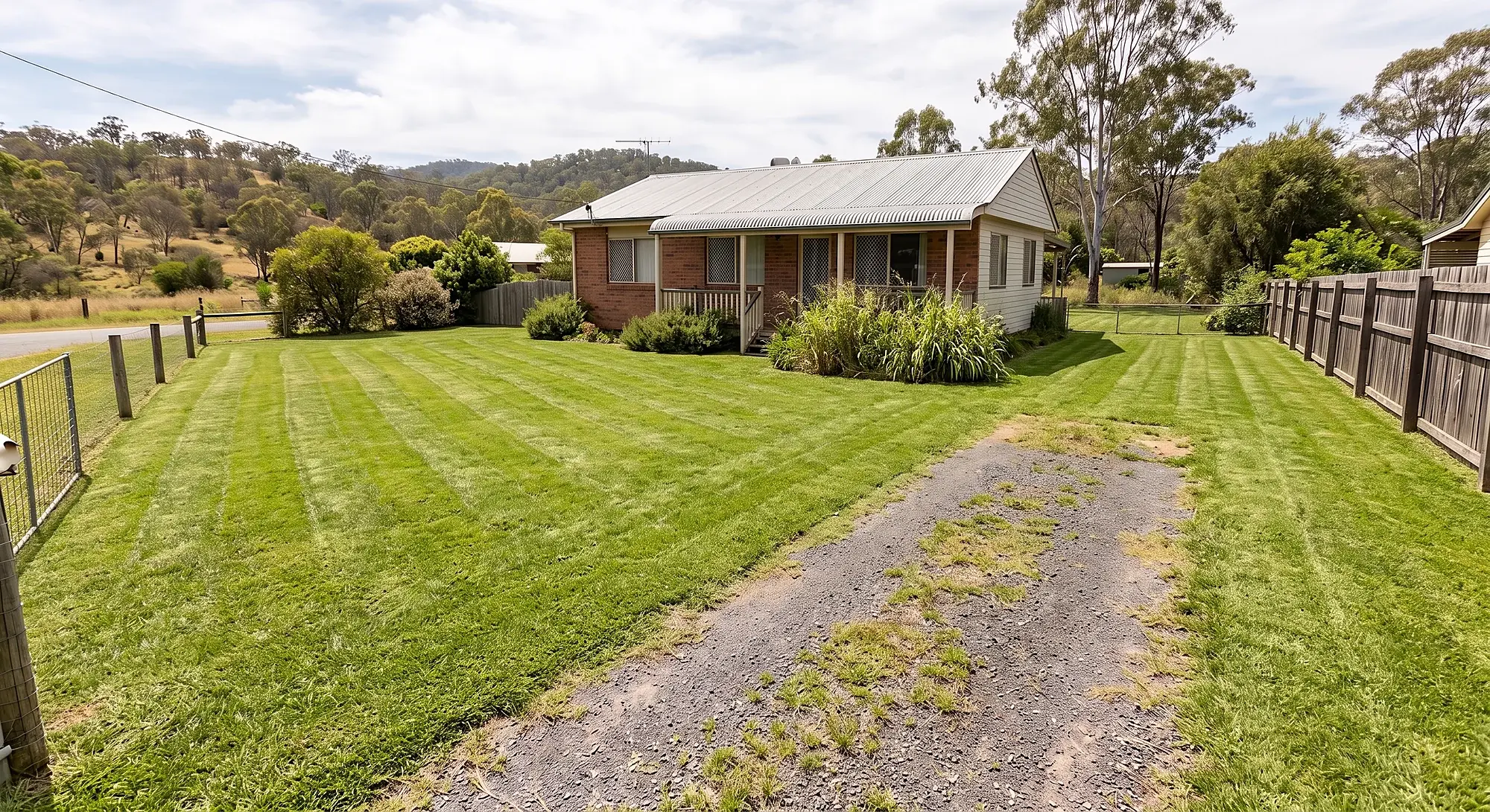 The same block after mowing, with a tidy striped lawn